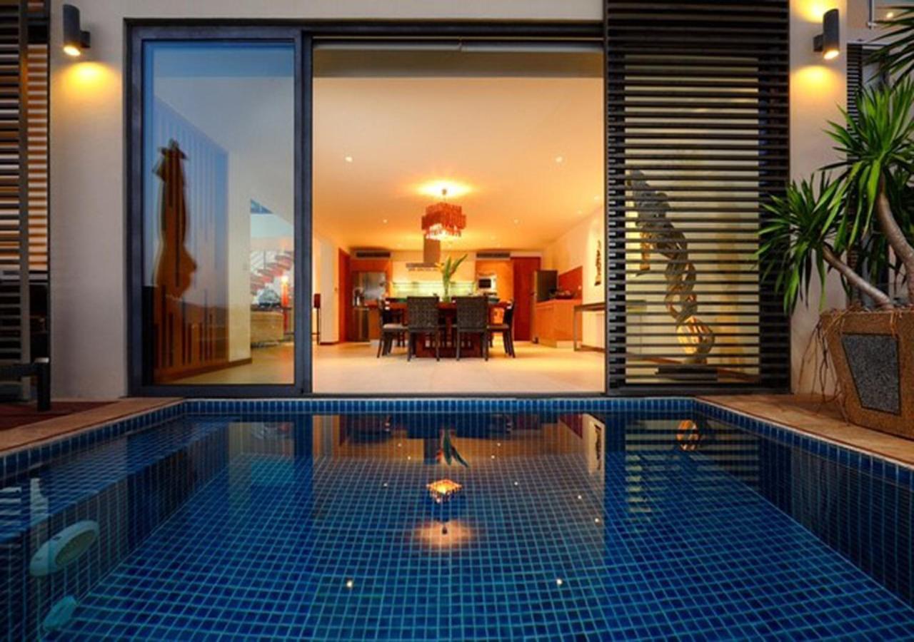 Indochine Resort And Villas - Sha Extra Plus Patong Exteriör bild A pool at the hotel