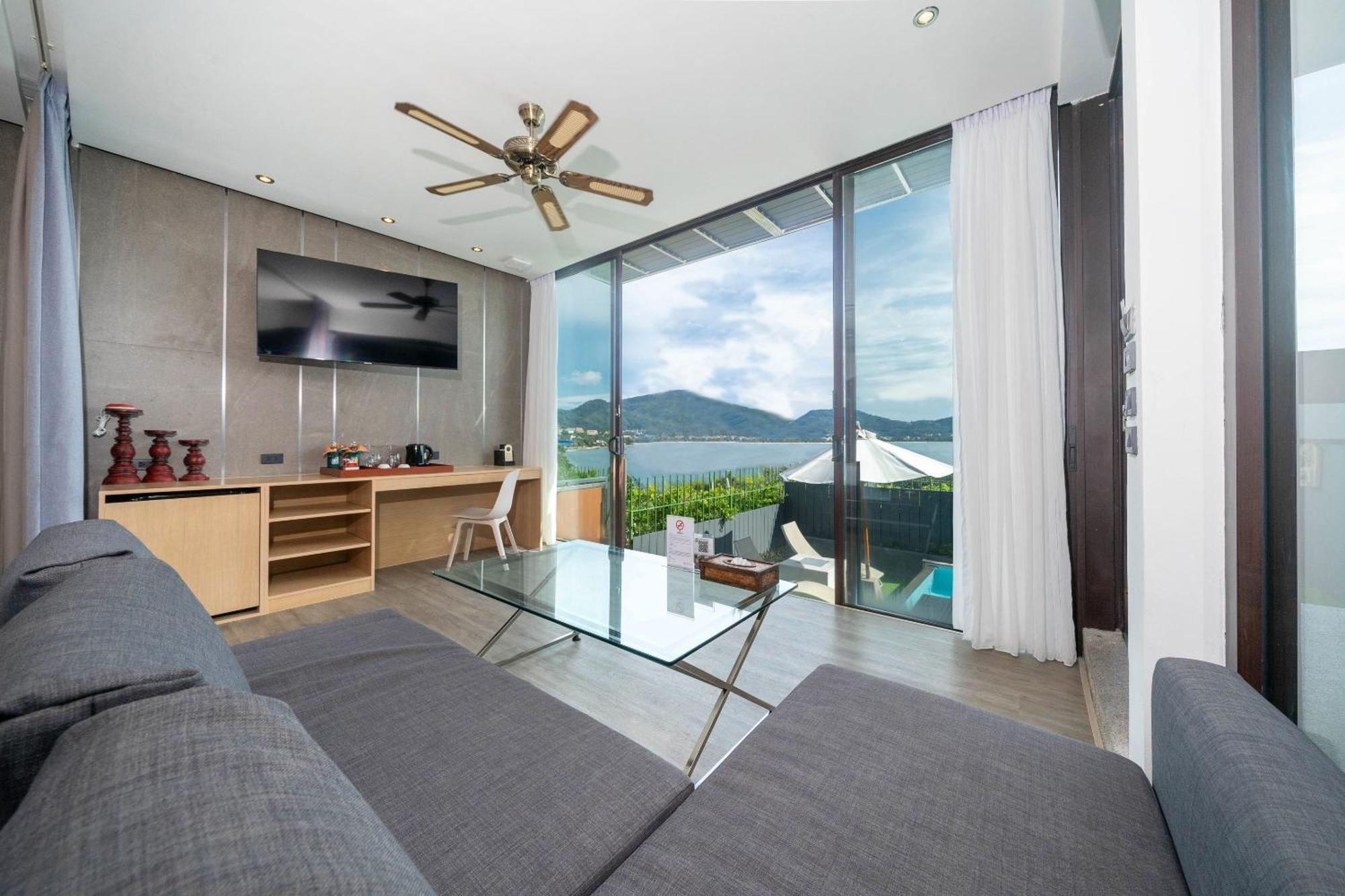 Indochine Resort And Villas - Sha Extra Plus Patong Exteriör bild A living room at the hotel